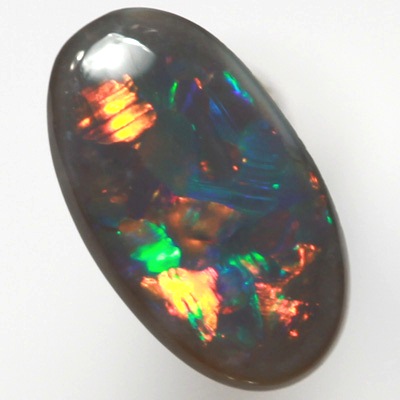 SOLID BLACK OPAL Flag Harlequin pattern. Sparkles of very bright fire red multicolour